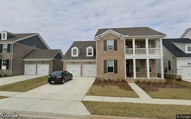 A brick two-story home on Rockwell Drive in Durham Farms