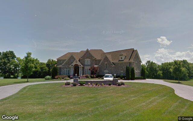 An estate home on the golf course side of Fairvue