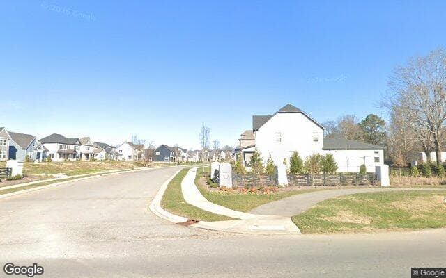 The entrance to Laurel Park off Long Hollow Pike in Hendersonville — finished two-story homes and sidewalks