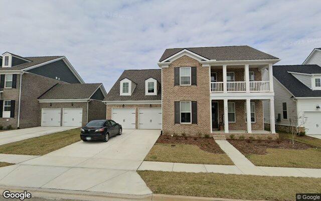 A brick two-story home on Rockwell Drive in Durham Farms