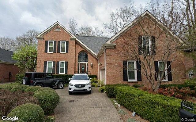 Brick homes tucked among the trees.