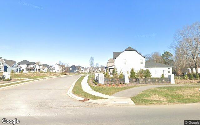 The entrance to Laurel Park off Long Hollow Pike in Hendersonville — finished two-story homes and sidewalks