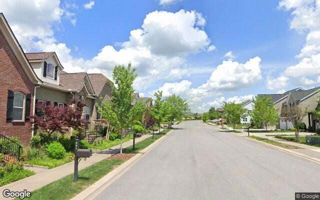 An established, tree-lined residential street in Millstone, Hendersonville